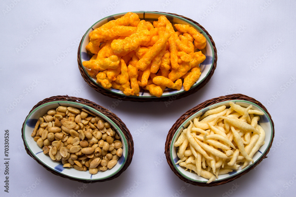 Snacks on ceramic and rattan fancy platter from top view Snacks on ceramic and rattan fancy platter from top view