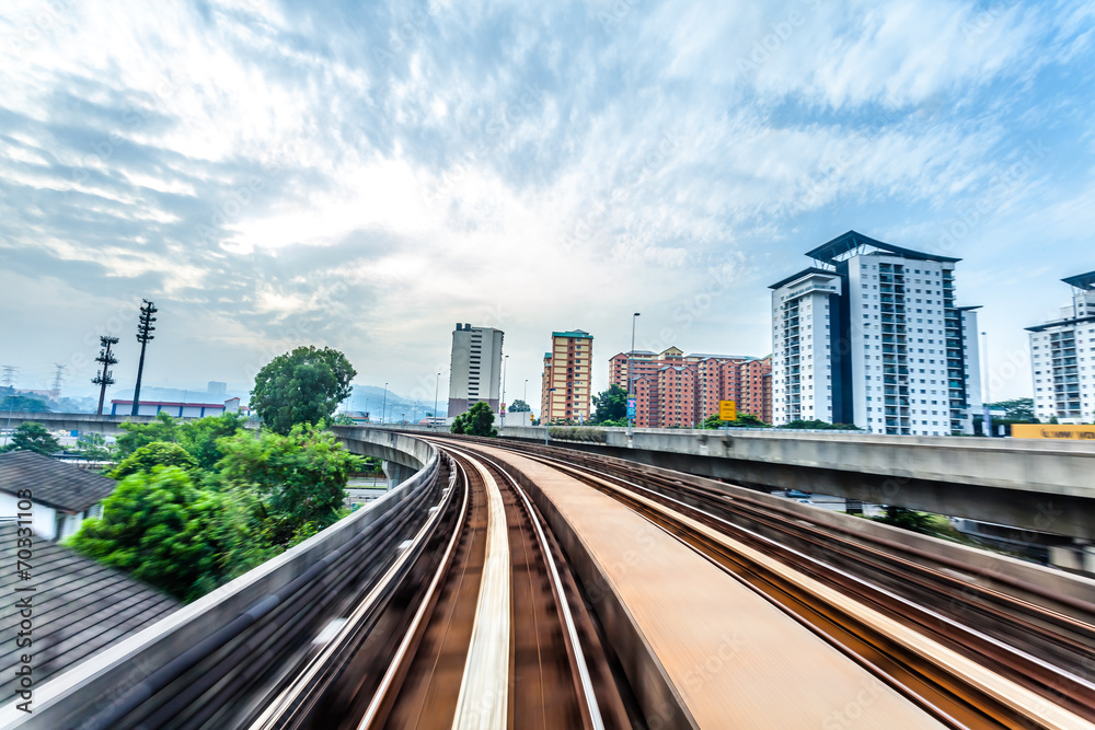 Fototapeta premium Sky train through the city center in Kuala Lumpur,motion blur