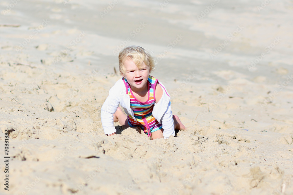 Little happy girl playing on the beach Little happy girl playing on the beach
