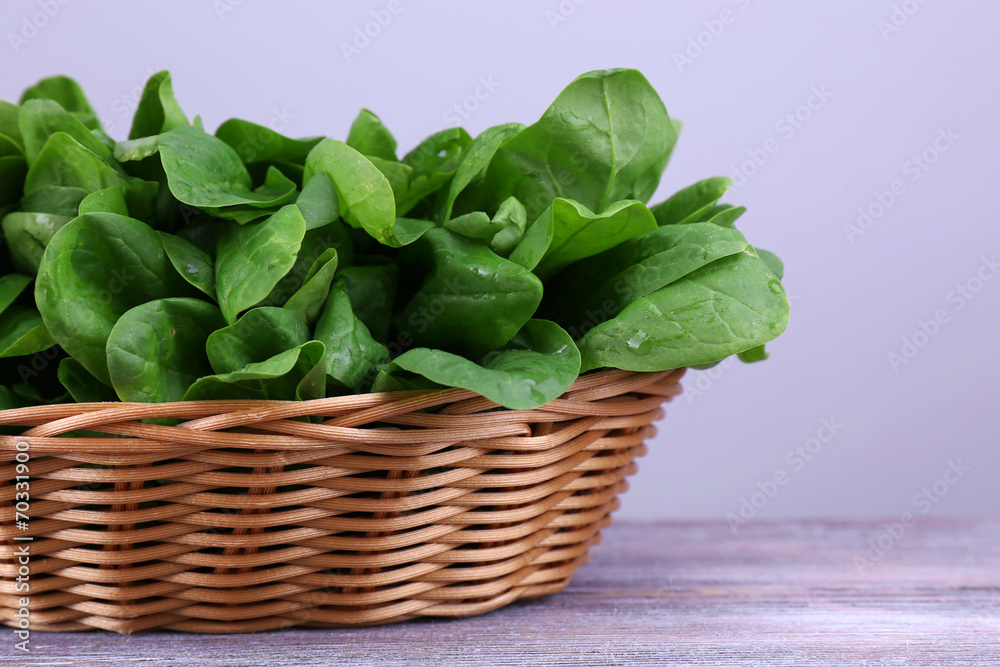 Fresh sorrel in round wicker basket on wooden background Fresh sorrel in round wicker basket on wooden background