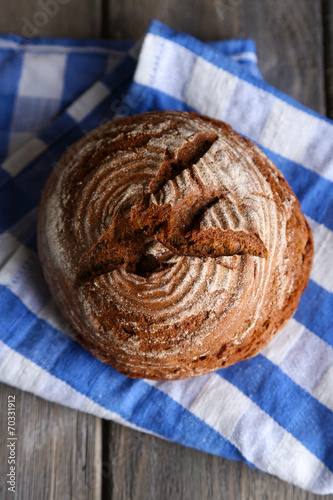 Fresh baked bread, on wooden background