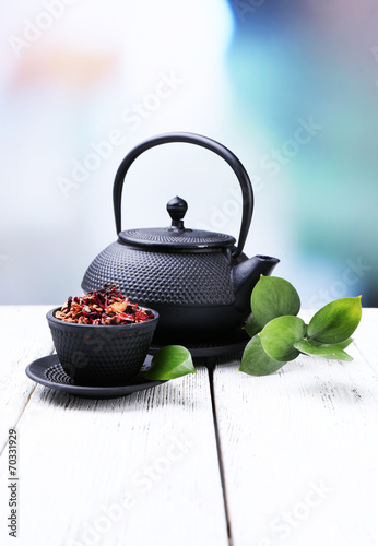 Black teapot, bowl and tea