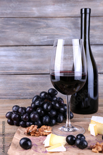 beautiful still life with wine  cheese and ripe grape