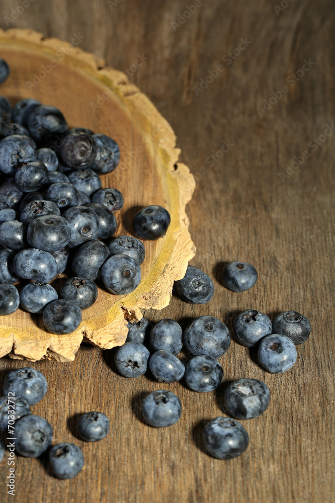 Tasty ripe blueberries, on wooden background Tasty ripe blueberries, on wooden background