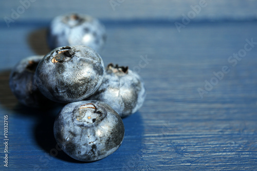 Tasty ripe blueberries  on wooden background