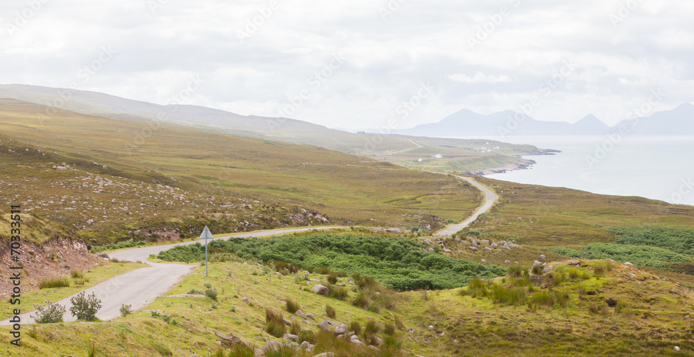 Highlands of Scotland narrow road in mountain landscape