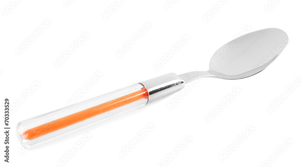 Metal spoon with color plastic handle isolated on white Metal spoon with color plastic handle isolated on white