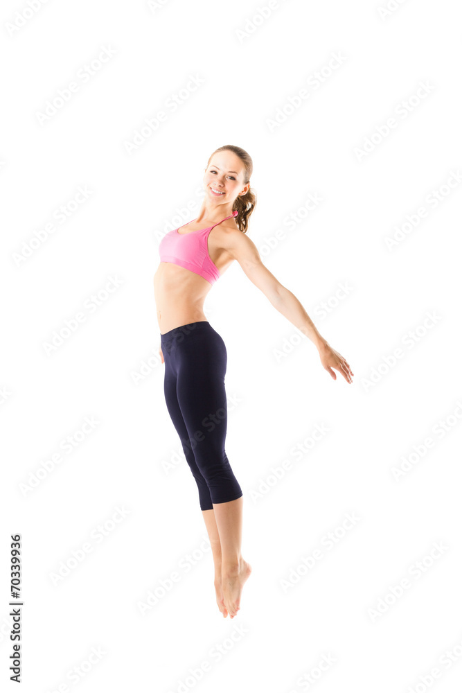 Young girl in sportswear jumping and stretching Young girl in sportswear jumping and stretching