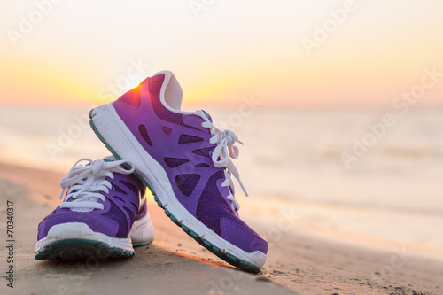 Pair of sports shoes on the beach