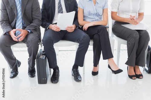 Business people sitting in a row
