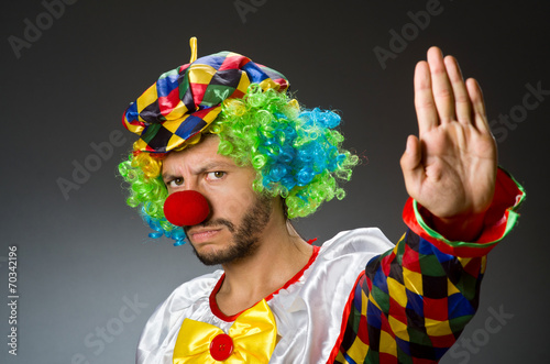 Funny clown in colourful costume
