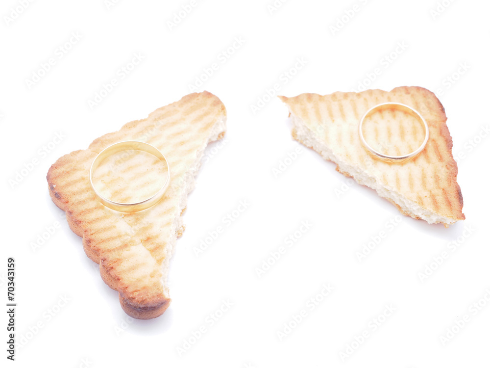 wedding rings and cookies on a white background wedding rings and cookies on a white background