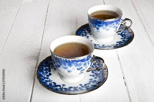 Blue tea cups in white
