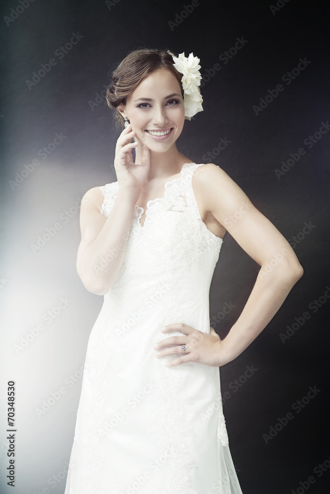 Glamorous young bride in wedding dress, smiling. Glamorous young bride in wedding dress, smiling.
