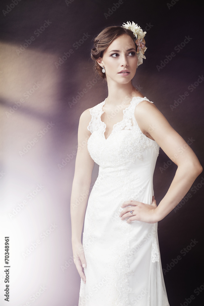 Elegant young bride in wedding dress, studio shot. Elegant young bride in wedding dress, studio shot.
