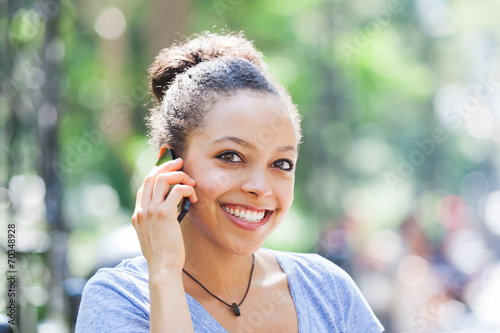 Beautiful Mixed Race Young Woman Talking on Mobile Phone