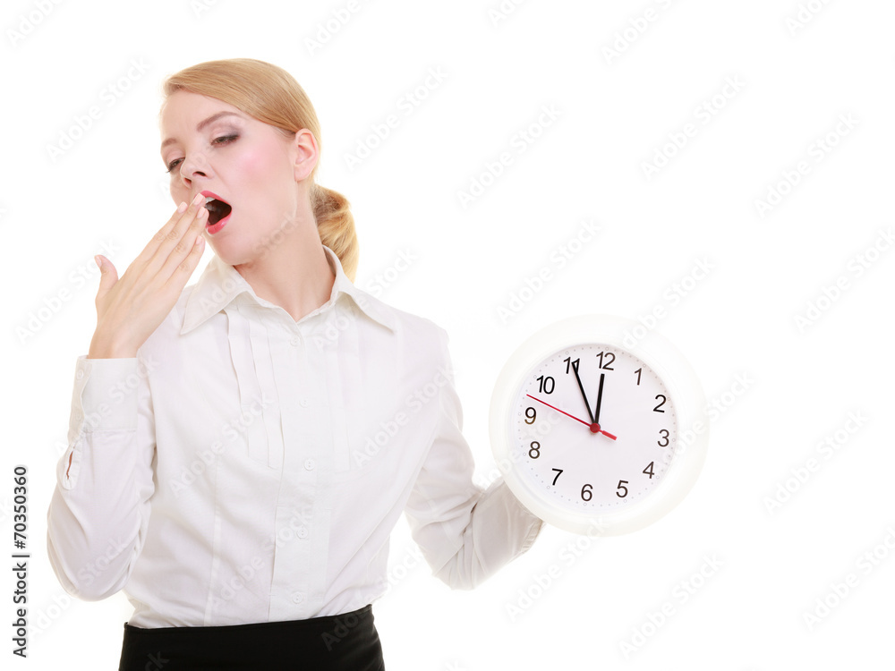 Overworked businesswoman showing clock and yawning. Time. Overworked businesswoman showing clock and yawning. Time.