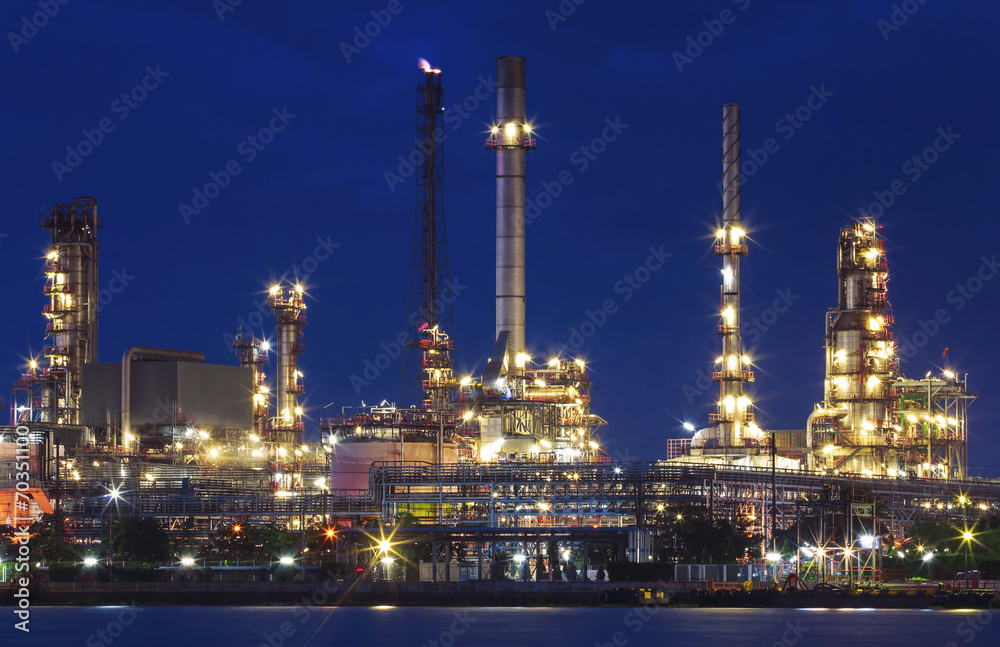 lighting of oil refinery plant in heavy industry estate against