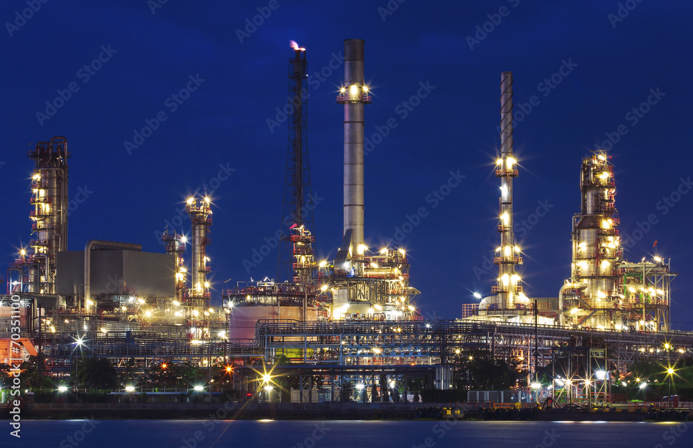 lighting of oil refinery plant in heavy industry estate against lighting of oil refinery plant in heavy industry estate against