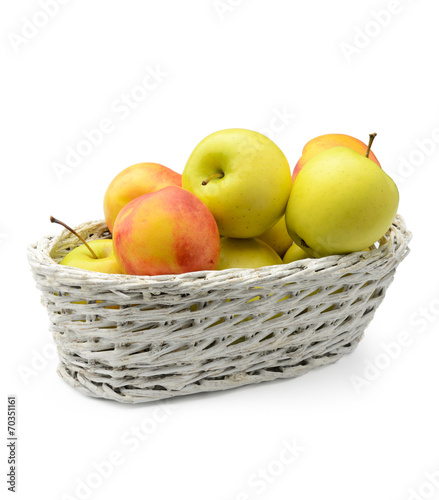 Apples and nectarines in a basket