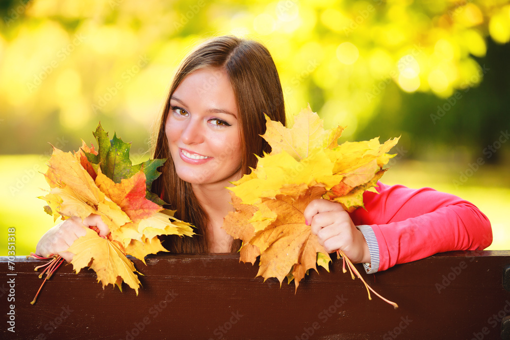 Fall season. Portrait girl woman holding autumnal leaves in park Fall season. Portrait girl woman holding autumnal leaves in park