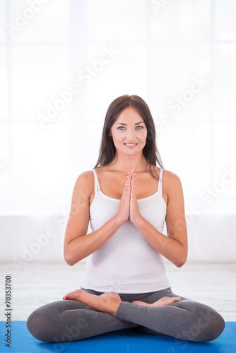 Happy woman doing yoga