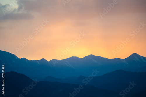 Colorful gradient sunset under the distant Tibetan mountains