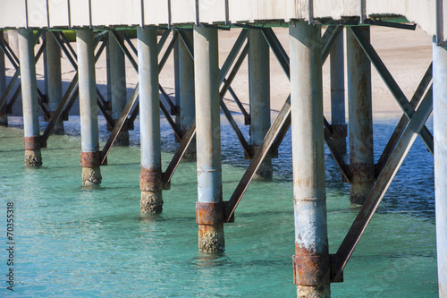 Closeup detail of metal pier supports photo