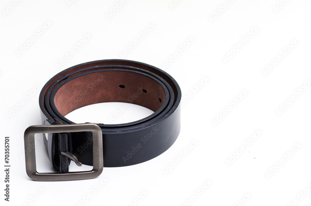 Elegant man's black leather belt rolled up isolated on white. Elegant man's black leather belt rolled up isolated on white.