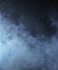 Light blue smoke on a black background