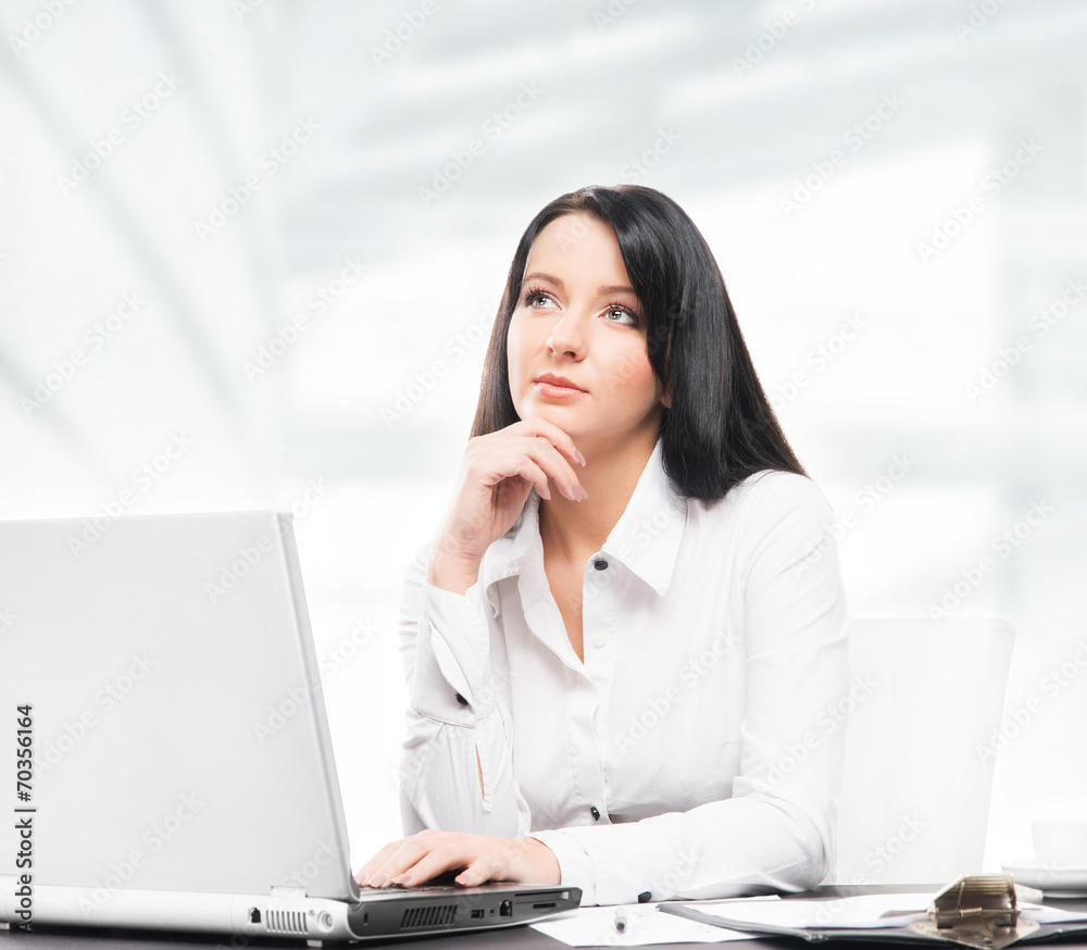 Young and attractive business woman working in office Young and attractive business woman working in office