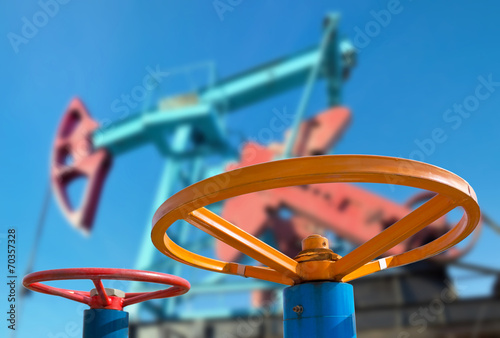 Bild auf Leinwand Oil valve with rocking in the background