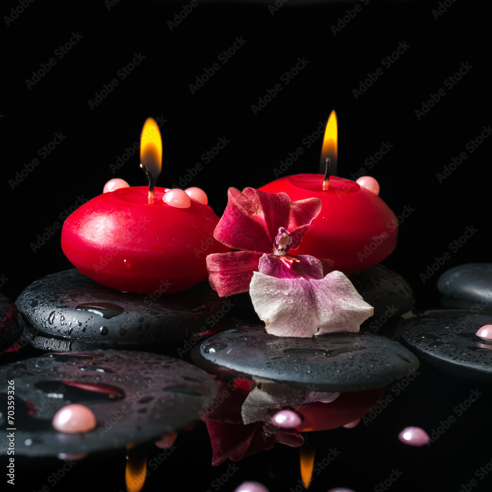 spa still life of red candles, zen stones with drops, orchid cam Stock  Photo | Adobe Stock