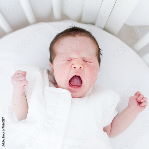 Baby girl yawning