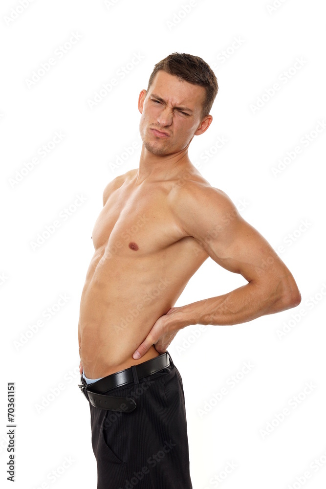 Young man with back pain on isolated white background