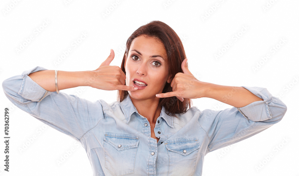 Friendly adult brunette with phone gesture Friendly adult brunette with phone gesture