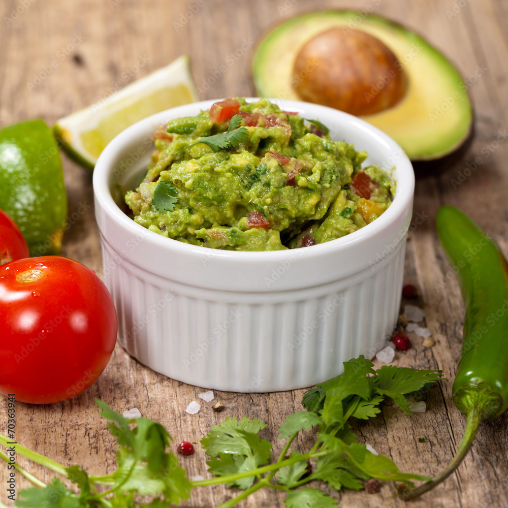 Guacamole with avocado, lime, tomato and cilantro Guacamole with avocado, lime, tomato and cilantro