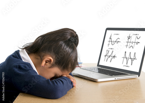 little schoolgirl bored and tired with computer maths homework