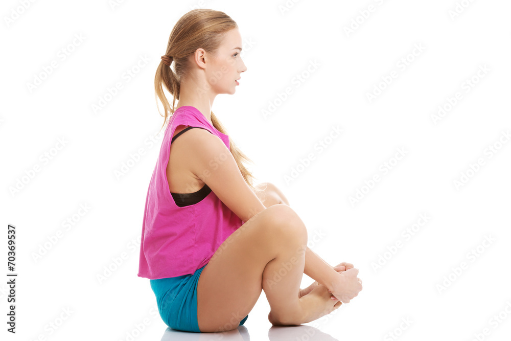 Young healthy girl doing stretching exercises Young healthy girl doing stretching exercises