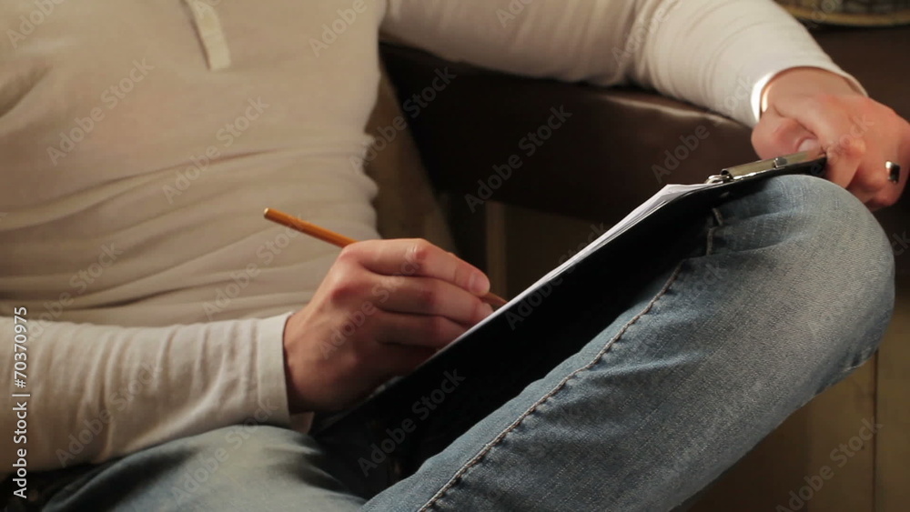 Man Writing a Song in Artistic Atmosphere
