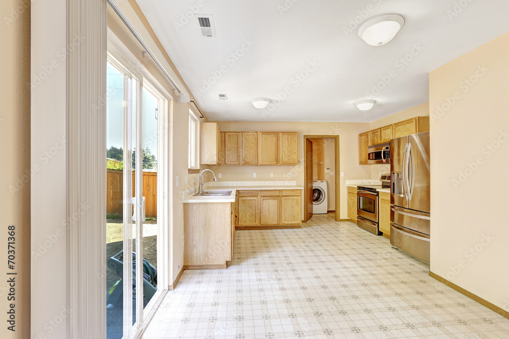 Obraz premium Contryside house interior. Kitchen room with exit to backyard ar