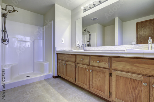 Spacious bathroom interior with open shower