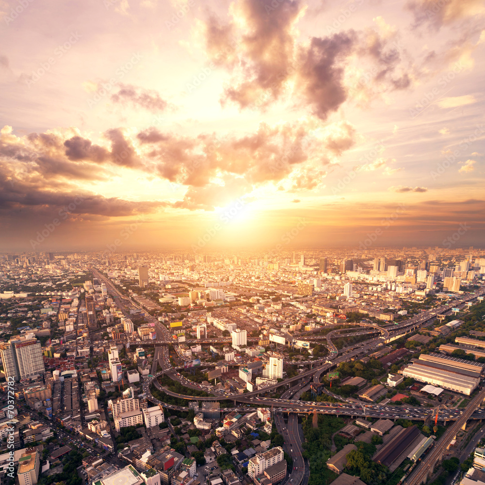 Fototapeta premium bird view of urban cityscape at sunset
