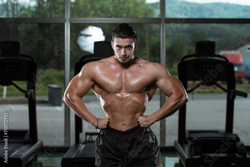Male Bodybuilder Flexing Muscles