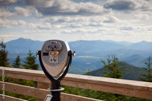 Coin operated public view binoculars with Adirondack mountains