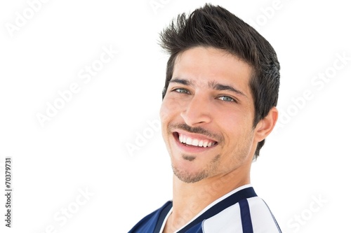 Portrait of smiling handsome football player