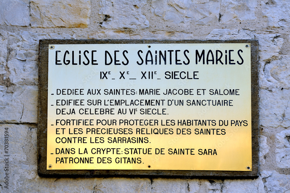 Fototapeta premium plaque explaining the history of the church of Saintes-Maries-de