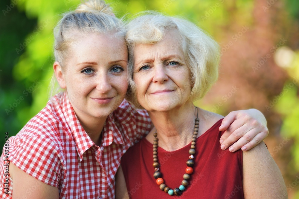 Mother and daughter in park.