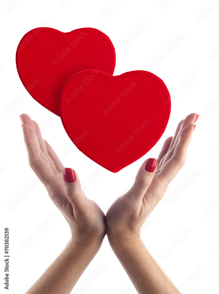 Red hearts in hands Red hearts in hands