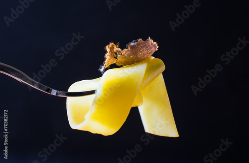 Pasta with truffle dark background copy space.